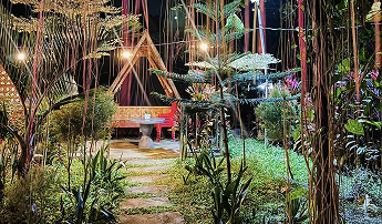 Outdoor lounge area with string lights