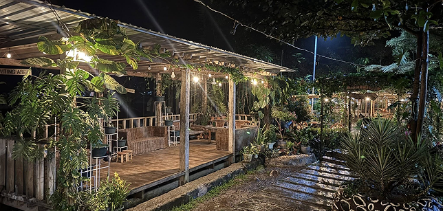 Wooden pavilion lit up at night